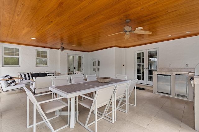 dining space featuring french doors, light tile patterned flooring, and wooden ceiling