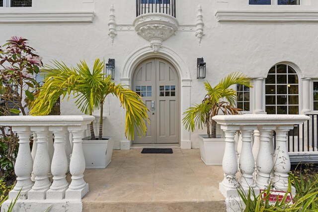 view of patio with french doors, an outdoor kitchen, ceiling fan, and a grill