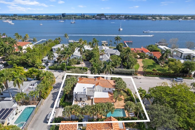 birds eye view of property with a water view