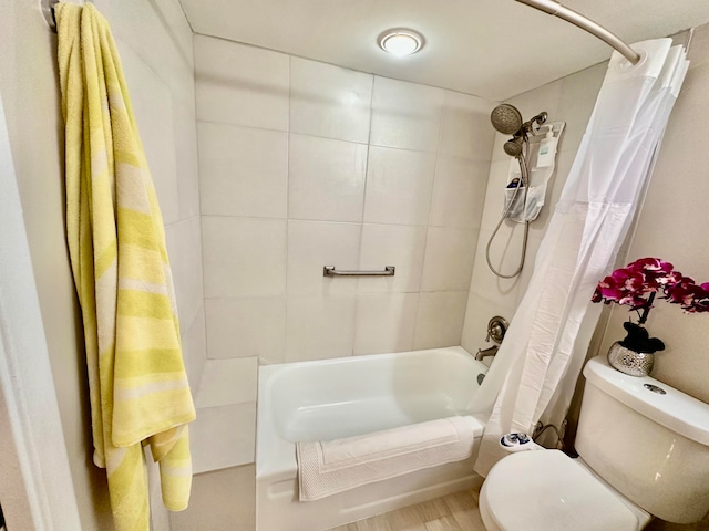 bathroom featuring hardwood / wood-style floors, shower / bath combination with curtain, and toilet