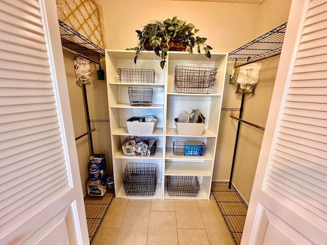 spacious closet featuring light tile patterned floors