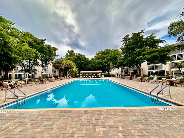 view of swimming pool with a patio area