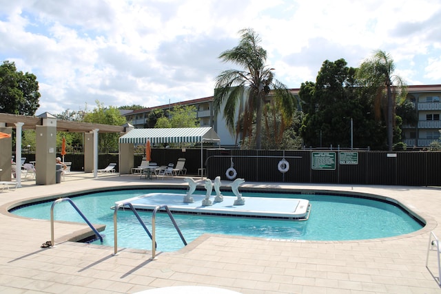 view of pool featuring a patio