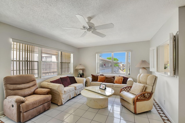 tiled living room with a textured ceiling and ceiling fan