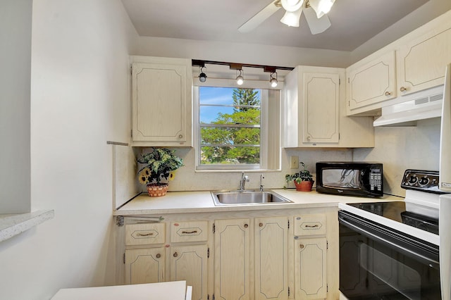 kitchen featuring white range with electric cooktop, ceiling fan, and sink