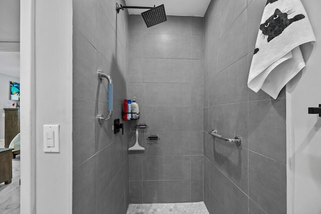 bathroom with tiled shower