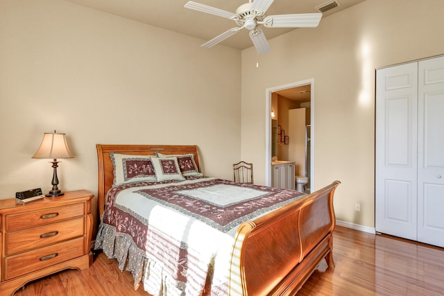 bedroom with ceiling fan, wood-type flooring, and a closet