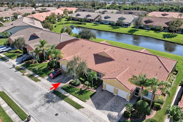 birds eye view of property featuring a water view