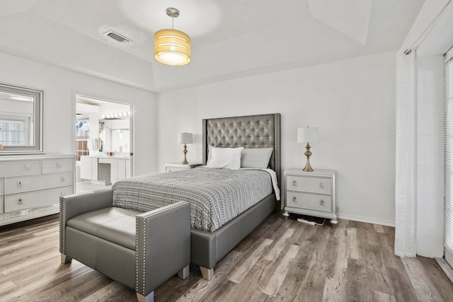 bedroom with wood-type flooring