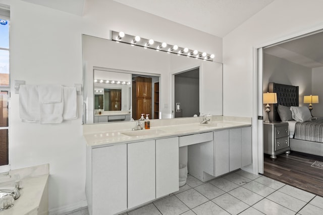 bathroom with hardwood / wood-style floors and vanity