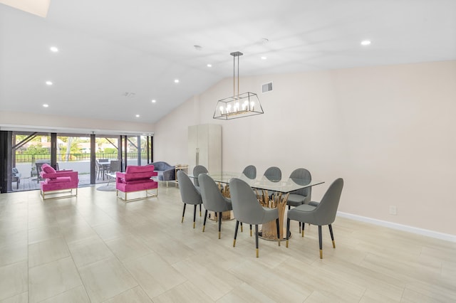 dining area featuring lofted ceiling