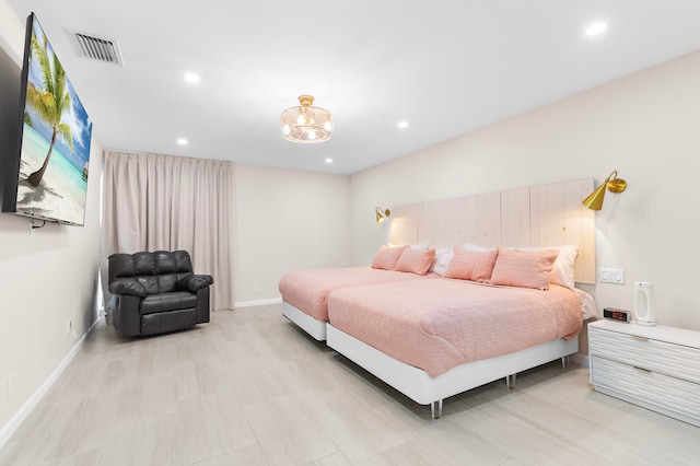 bedroom featuring a notable chandelier