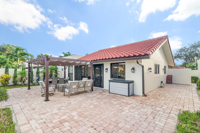 back of house featuring a pergola, a patio, and an outdoor hangout area