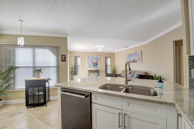 kitchen featuring sink, light stone counters, stainless steel dishwasher, decorative light fixtures, and white cabinets