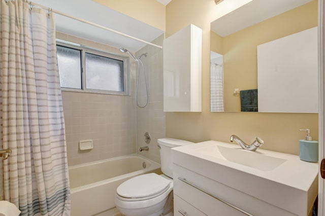 full bathroom featuring shower / bath combo with shower curtain, vanity, and toilet