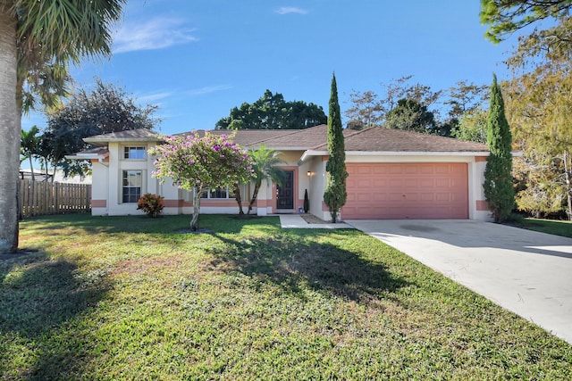 ranch-style home featuring a front yard and a garage