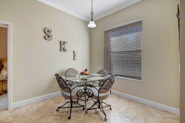 dining space with light tile patterned floors and ornamental molding