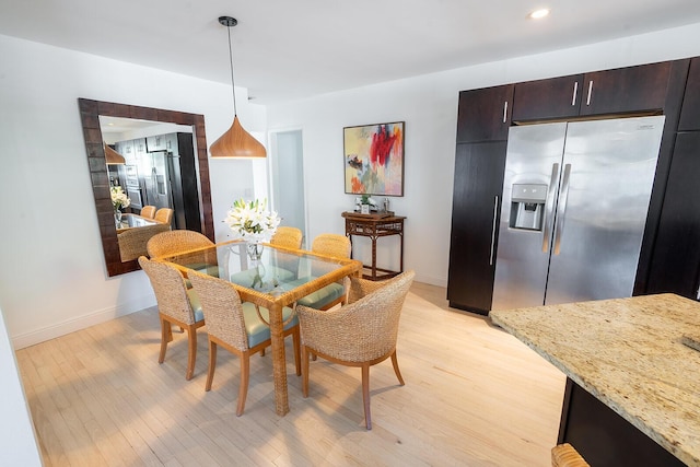 dining room with light hardwood / wood-style floors