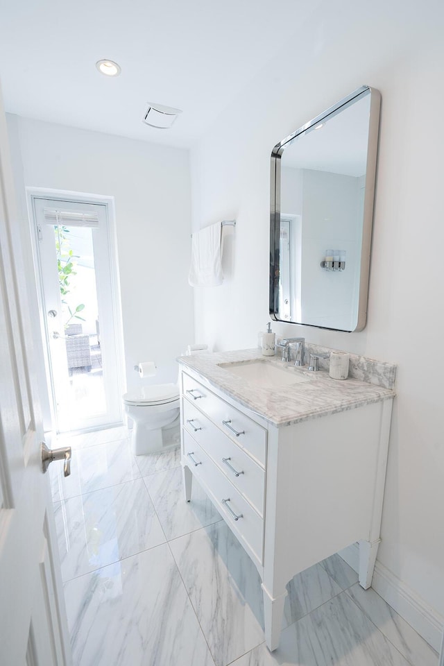 bathroom with vanity and toilet