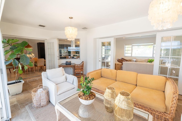 living room with an inviting chandelier