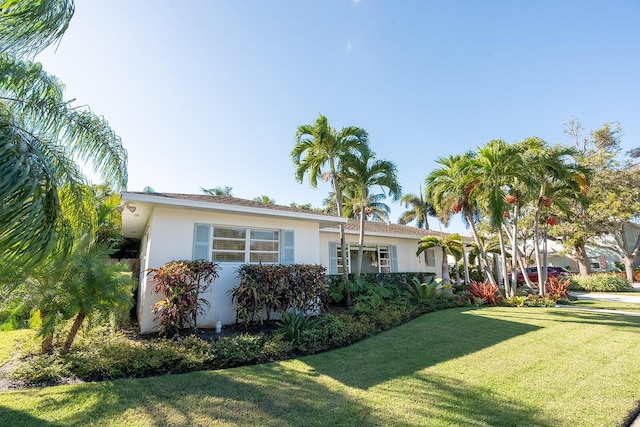 ranch-style house with a front yard