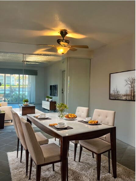 dining room featuring ceiling fan