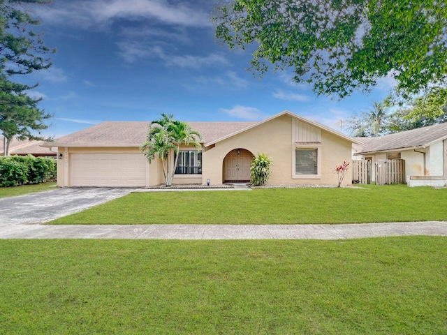 ranch-style home featuring a front yard and a garage