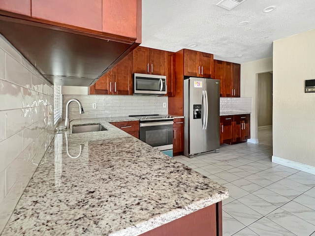 kitchen featuring light stone countertops, backsplash, stainless steel appliances, sink, and light tile patterned flooring