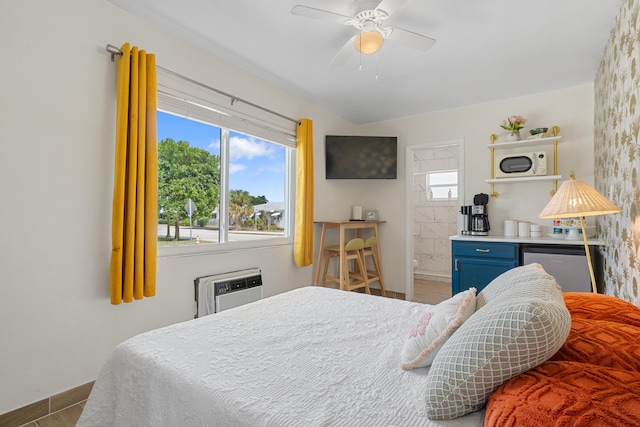 bedroom with hardwood / wood-style floors, a wall unit AC, and ceiling fan