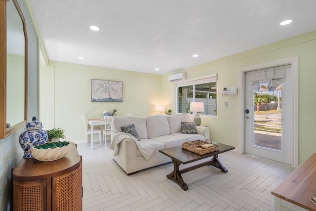 living room featuring light parquet floors and a wall unit AC