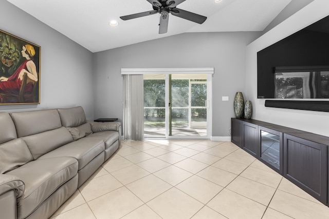 living room with ceiling fan, lofted ceiling, and light tile patterned floors