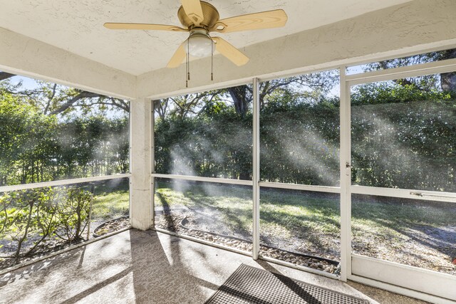 exterior space with ceiling fan