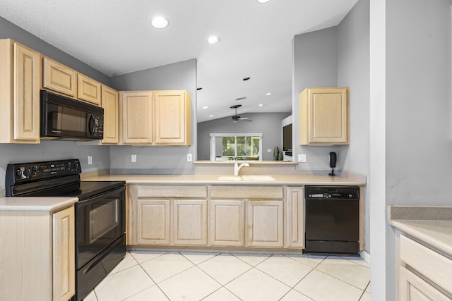 kitchen featuring light brown cabinets, ceiling fan, sink, black appliances, and lofted ceiling