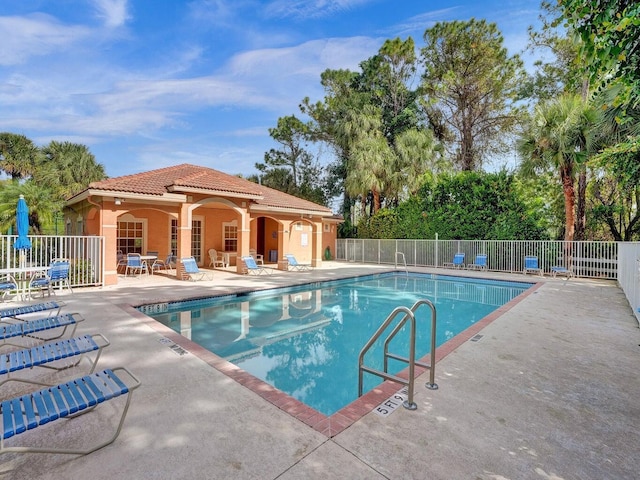 view of swimming pool featuring a patio area