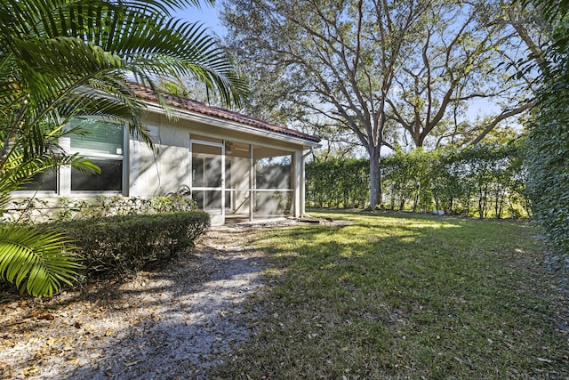 view of yard featuring a sunroom