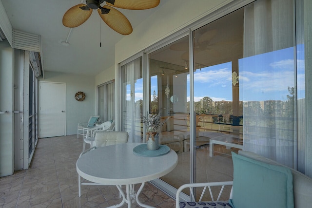 sunroom / solarium with ceiling fan