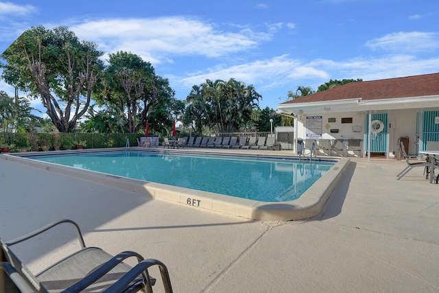 view of swimming pool featuring a patio