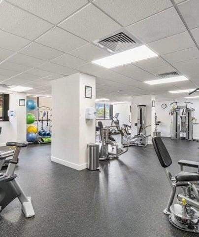 exercise room featuring a paneled ceiling