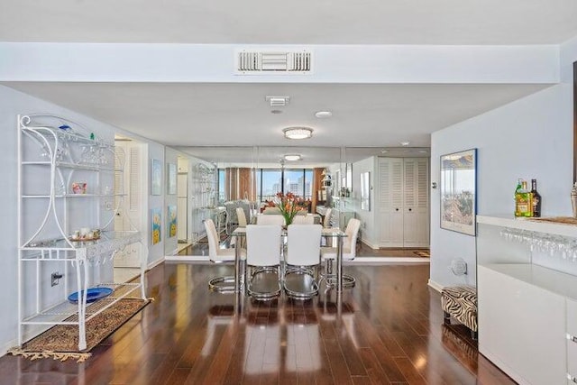 dining room with dark hardwood / wood-style floors