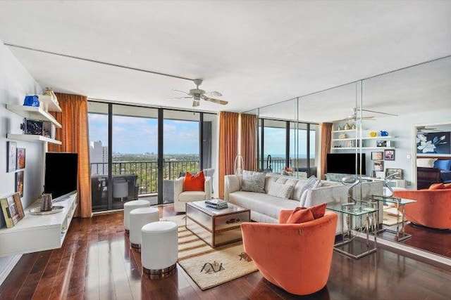 living room with ceiling fan, floor to ceiling windows, and dark hardwood / wood-style flooring