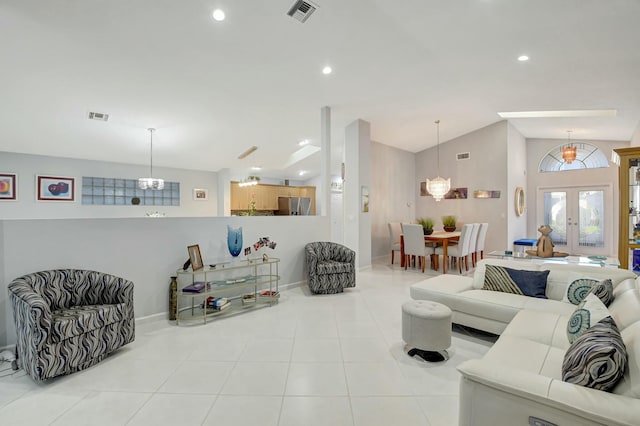 living room with french doors, light tile patterned floors, and vaulted ceiling