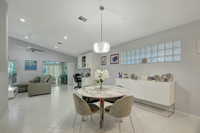 tiled dining area with ceiling fan and vaulted ceiling