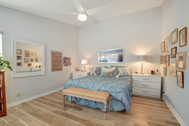 bedroom with ceiling fan and light hardwood / wood-style floors