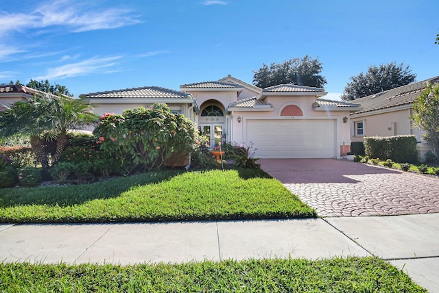 mediterranean / spanish house with a garage