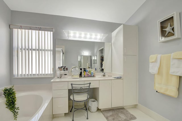 bathroom with vanity and a tub to relax in