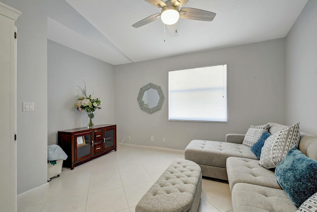 tiled living room featuring vaulted ceiling and ceiling fan