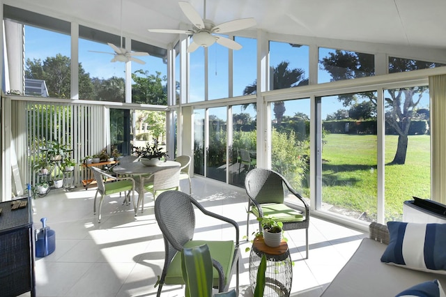 sunroom with a wealth of natural light and lofted ceiling