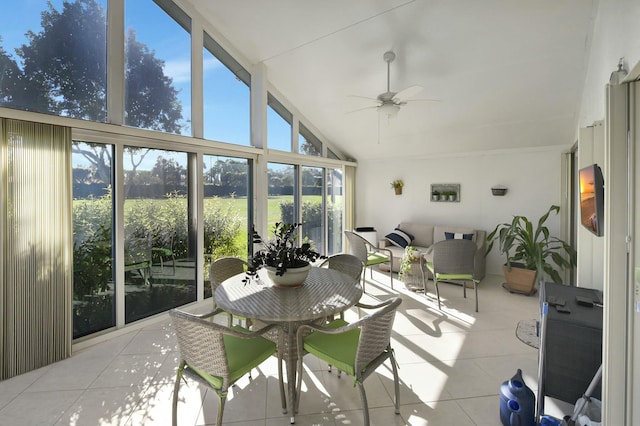 sunroom with ceiling fan and vaulted ceiling