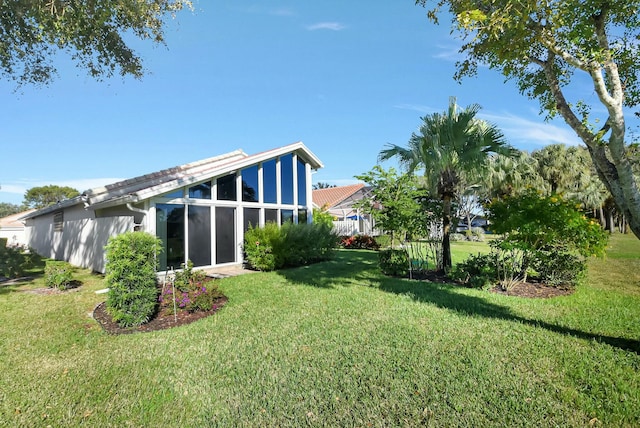 view of yard featuring a sunroom