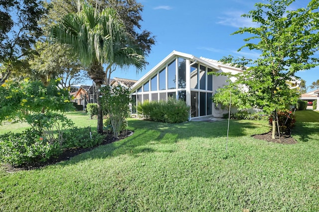 view of yard with a sunroom